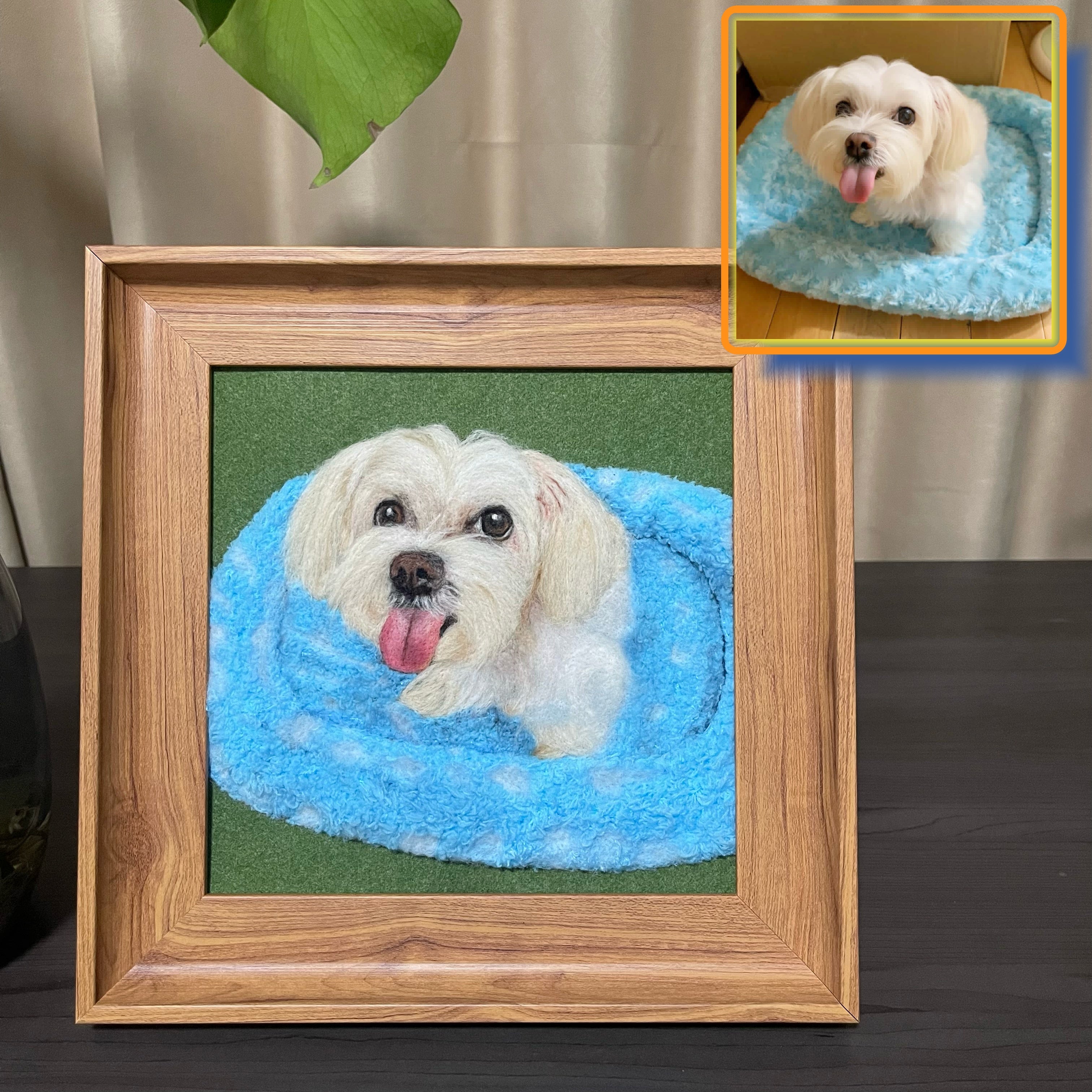 Framed picture of a dog on a blue bed with an inset showing the same scene.
